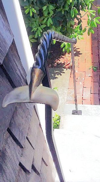 close up of whale tail and rope railing